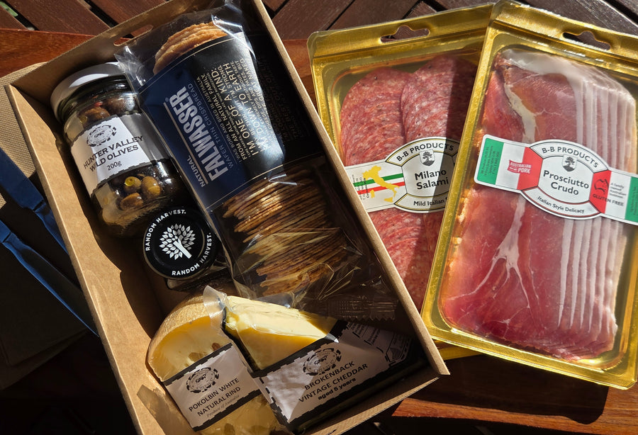 Picnic Grazing Box of Hunter Valley cheeses wafers, local olives, prosciutto and salami.