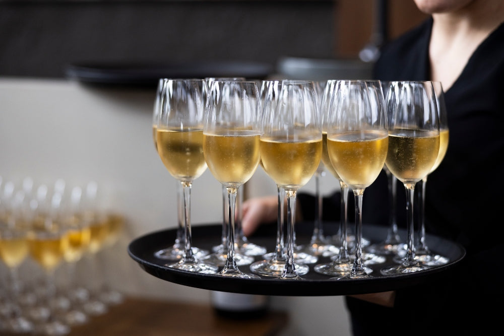 Sparkling Wine poured & being served at a pepper Tree Wine Club event